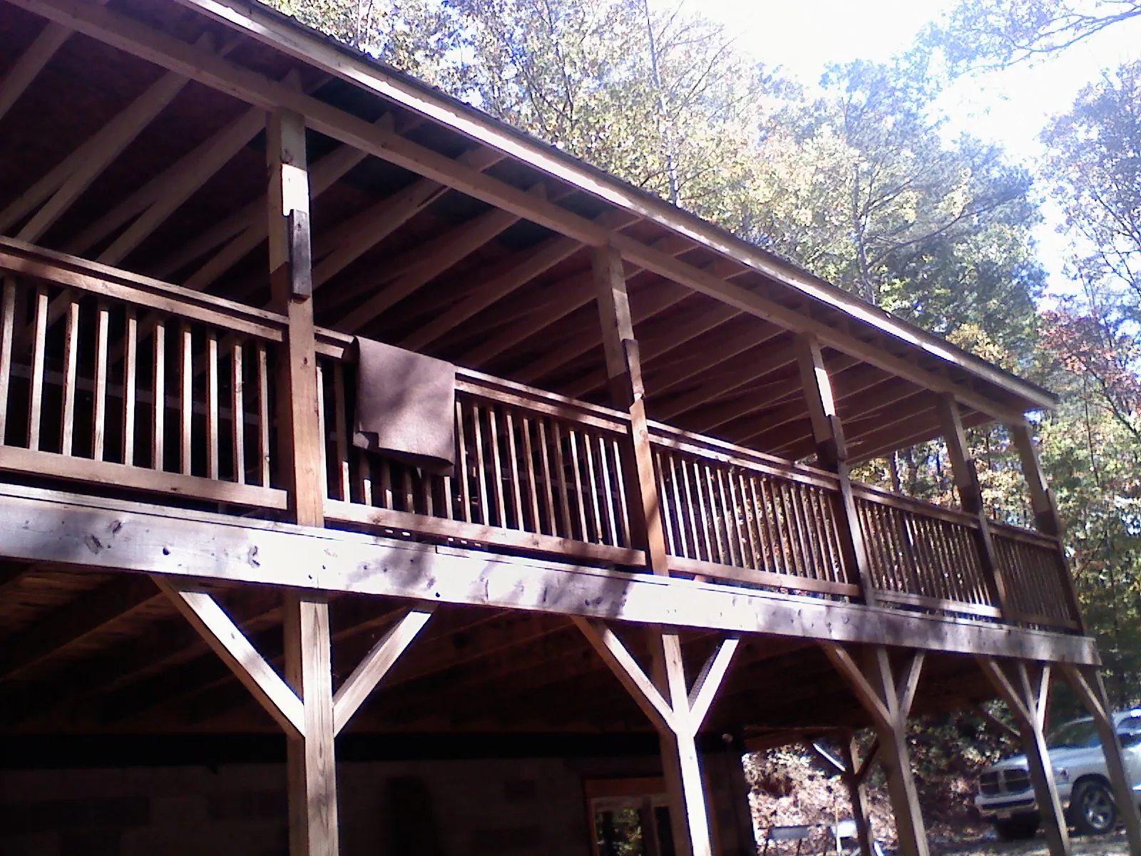 Timber framing under a new elevated porch and deck — Roof Leak Repair in Raymond by Roofing Brothers